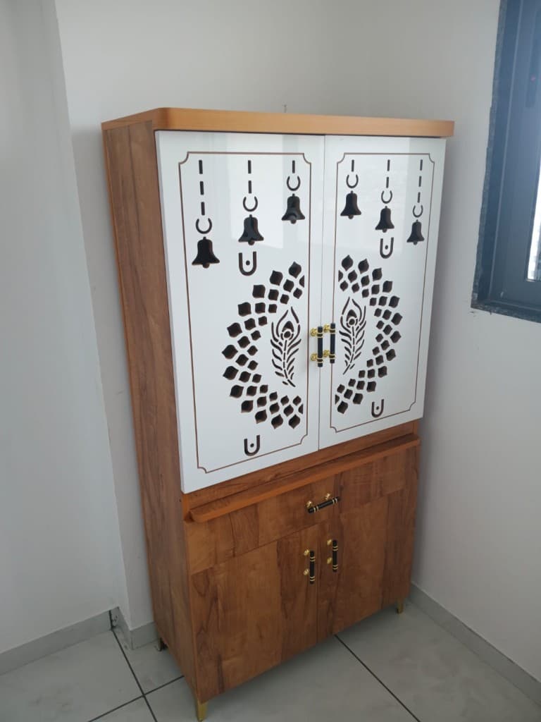 Traditional wooden pooja unit with laser-cut peacock design doors in New Ranip